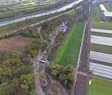 Der versetze Flusslauf im reaktivierten Auenwald und der zugeschüttete Kanal. Links oben sind die A13 und dahinter der Alpenrhein zu erkennen. 		  (© Amt für Wasser und Energie Kt. St. Gallen) Der versetze Flusslauf im reaktivierten Auenwald und der zugeschüttete Kanal. Links oben sind die A13 und dahinter der Alpenrhein zu erkennen. 		  (© Amt für Wasser und Energie Kt. St. Gallen)